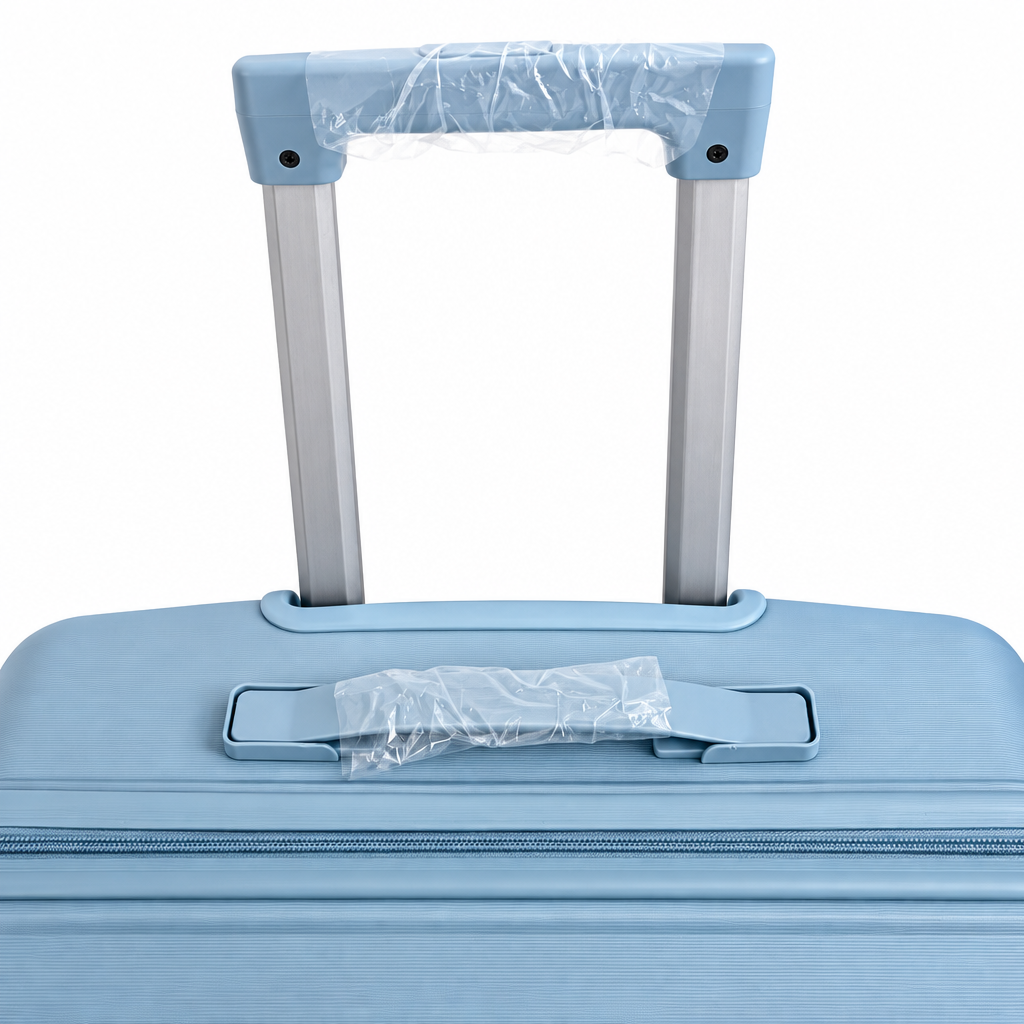 Telescopic handle on hardshell luggage on white background
